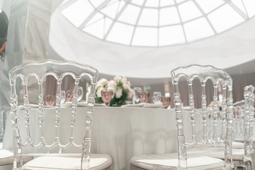 Round Banquet table served. Interior of restaurant for wedding dinner, ready for guests. Decorated...