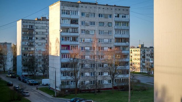 Day to night time lapse of a city with block housing 