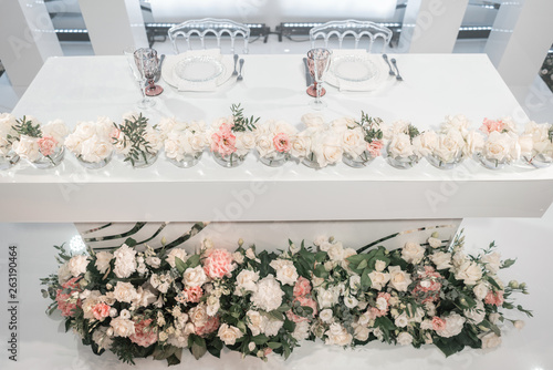 The Table Of Newlyweds Small Flower Arrangements In Ball Gl The Table Of Newlyweds Small Flower Arrangements In Ball Gl Vases Interior Restaurant For Wedding Dinner Ready Guests Catering Concept