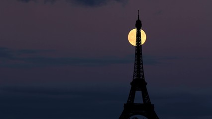 Moon rise behind Eiffel Tower Paris