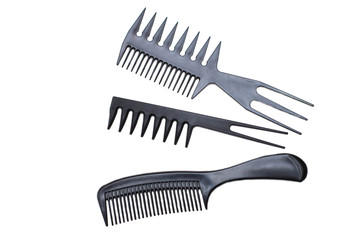 Plastic black hairbrushes on a white background - isolate