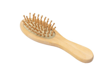 Wooden massage comb on a white background - isolate