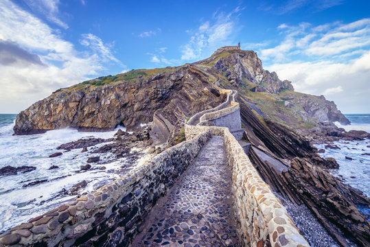 Manmade way to small isle with San Juan de Gaztelugatxe hermitage on the Atlantic shore in Biscay region of Sapin