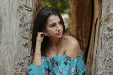 Sexy young brunette beauty in a rain forest