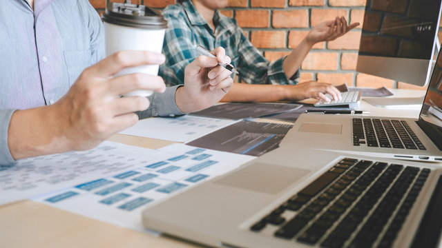 Professional Developer programmer cooperation meeting and brainstorming and programming in website working a software outsourcing and coding technology, writing codes and database