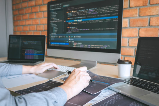 Professional Developer programmer working a software website design and coding technology, writing codes and database in company office, Global cyber connection technology