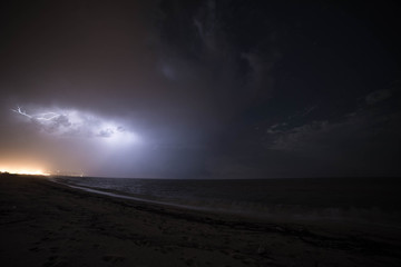 Naklejka na ściany i meble summer storm with lightning at the beach
