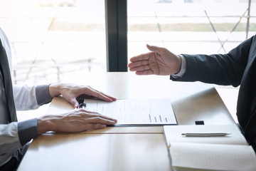 Employer or recruiter holding reading a resume during about colloquy his profile of candidate,...