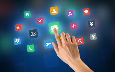 Female hand touching colorful applications 