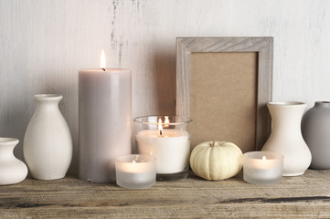Fototapeta na wymiar Neutral colored vases and candles as home decor