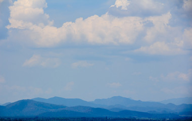 landscape with mountains and clouds, blue tone.