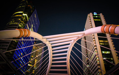 Naklejka premium Sky walk at night architecture for passenger to transit between BTS and MRT train at sathorn station on Bangkok Thailand April 19,2019