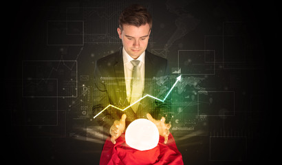 Young businessman making predictions of the future of the stock market with a magic ball
