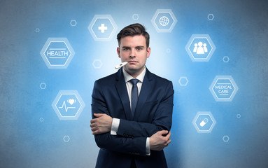 Young businessman with medical care, pills concept

