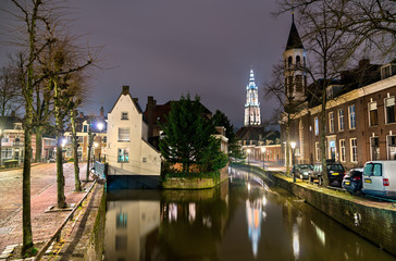 Fototapeta na wymiar Traditional Dutch buildings along a canal in Amersfoort, Netherlands