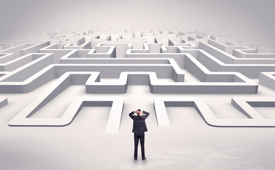 Businessman getting ready to enter a 3D flat labyrinth concept
