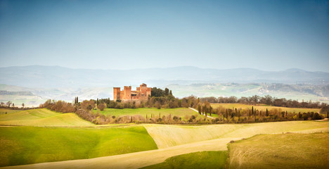 Fototapeta premium View of Castle of Gallico. Beautiful landscape of hills and fields near Asciano in Tuscany, Siena, Italy