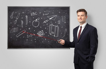 Handsome young teacher with laser pointer teaching 
