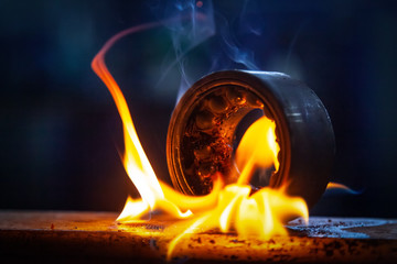 Close-up of the burning of the automotive part of the bearing using a gasoline burner in the auto...