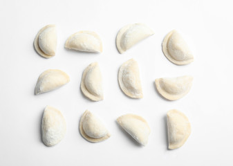 Raw dumplings on white background, top view. Home cooking