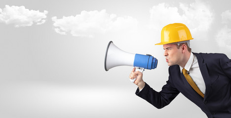 Fototapeta premium Young supervisor architect yelling to far big city panorama 