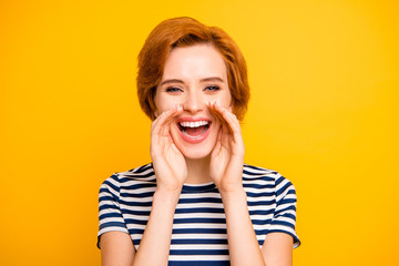 Close up photo beautiful amazing she her lady hands arms raised near mouth yell share novelty chatterbox  wearing casual striped white blue t-shirt outfit clothes isolated yellow bright background