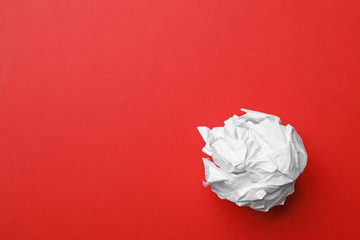 Crumpled sheet of paper on color background, top view. Space for text