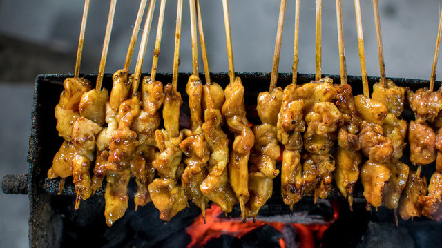 Satay or sate is an Indonesian and Malaysian dish consisting of small pieces of meat grilled on a skewer and served with a spiced sauce that typically contains peanuts.