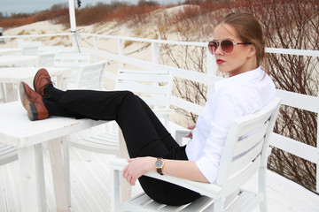 Lady boss sitting on the beach cafe and relax