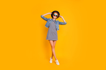 Full length body size view portrait of her she nice-looking pretty charming attractive cheerful cheery optimistic girl walking on air free time isolated over bright vivid shine yellow background