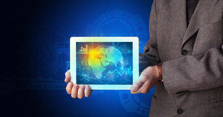 Hand holding tablet with global database concept
