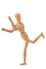 Wooden mannequin in running posing isolated on white