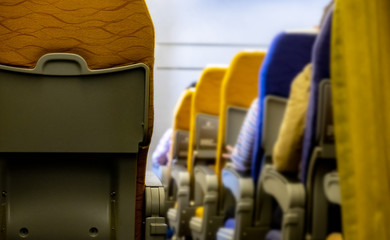 Fototapeta premium Passengers sitting inside airplane While traveling by plane