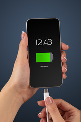 Elegant hand charging smartphone with low battery
