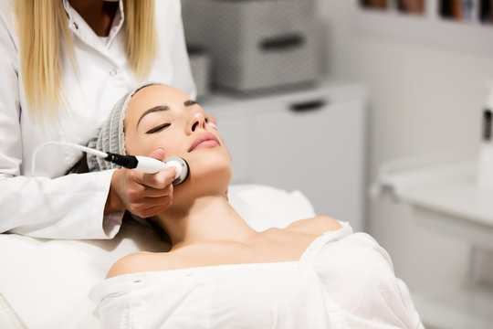 Beautiful Woman In Professional Beauty Salon During Photo Rejuvenation Procedure