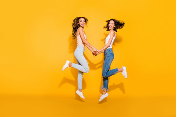 Fototapeta na wymiar Full length body size view photo lovely sweet teen funny teenagers funky satisfied laughter free time fool summer travel weekend holiday isolated glad checked shirt jeans long hair yellow background 