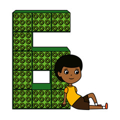 little black boy with number six and toy pieces