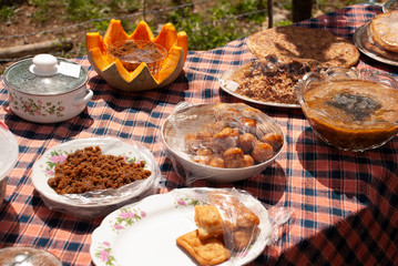 A table full of diffrent local traditional food dishes under the