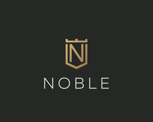 Premium monogram letter N initials logotype. Elegant shield crown vector logo.