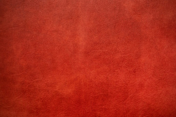 Abstract background of genuine red cartier leather