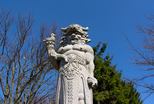 Granite statue of Radegast, Radhost hill / Pustevny, Beskids, Czech republic / Czechia - mythological west slavic god of hospitality, abundance, war. Low depth of field.
