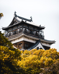 Hiroshima Castle covered in cherry blossoms and flowers