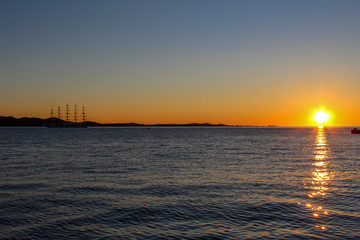 Sailing ship anchors in the sunset off the coast of Zadar, Croatia