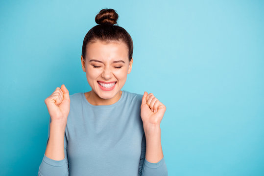 Close up photo beautiful amazing cute she her lady eyes closed crazy hold hands arms raised yelling goal funny funky trendy stylish hairstyle wear sweater pullover isolated blue bright background