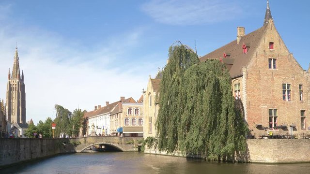 Brugge cityscape with famous Brugge's landmark Rozenhoedkaai canal and Brugge Belfry bell tower.