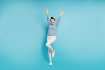 Fototapeta na wymiar Full length body size photo beautiful amazing she her lady funny stylish hairstyle raise hands arms up roar yell party birthday wear casual white pants sweater pullover isolated blue bright background