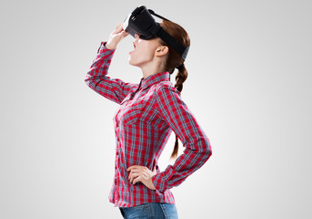 Girl in mask experiencing virtual reality as new entertainment device