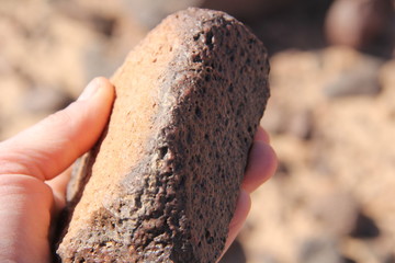 Ocher stone in palm