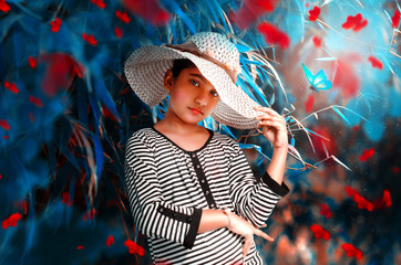 Fashion Model beautiful Girl with big hat outdoor posing for camera
