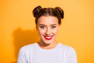 Close-up portrait of her she nice-looking lovable adorable attractive lovely winsome cheerful cheery lady with two buns isolated over bright vivid shine yellow background